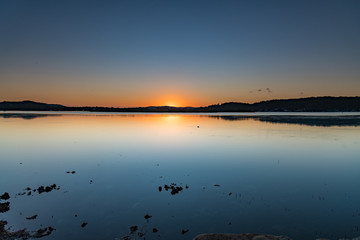 Sunrise and Clear Skies as the sun rises over the Bay