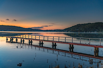 Smooth Sunrise with Light Cloud over the Bay