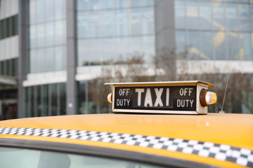 taxi sign on a cab roof