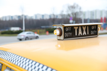 taxi sign on a cab roof
