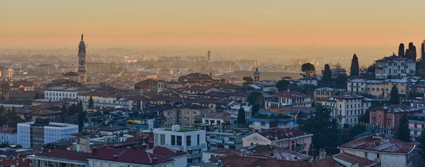 The view of the city of Bergamo at sunset from the walls of the upper city