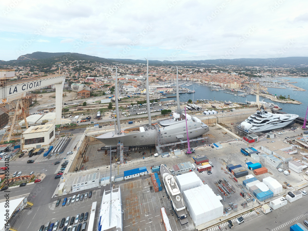 Wall mural aerial view of sea dry dock in la ciotat city, france, the cargo crane, boats on repair, a luxury sa