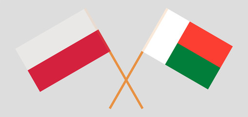 Crossed flags of Madagascar and Poland