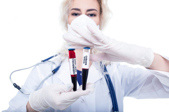 The Girl Doctor Holds In Her Hand Two Vials Of Blood In Which The Coronavirus Was Found