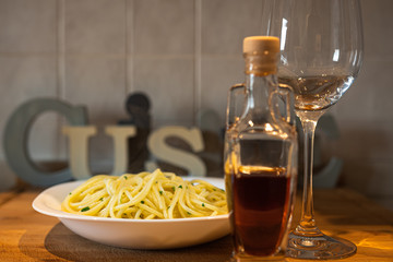  spaghetti with Cetara anchovy sauce. with glass of white wine