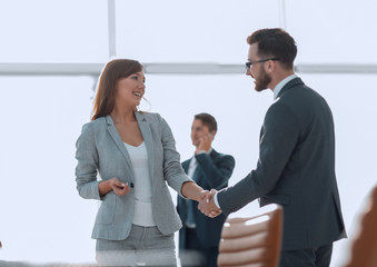 handshake between colleagues in the workplace