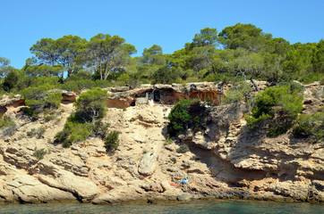 Fototapeta na wymiar Spain. The coast of the island of Ibiza. Troglodyte housing