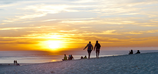 Sunset at sea, people have a rest
