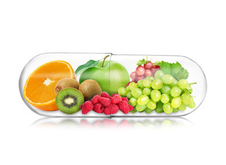 Obraz na płótnie Canvas Transparent capsule with different fruits and berries rich in vitamins on white background