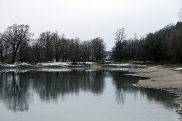 Winter landscape with lake and trees