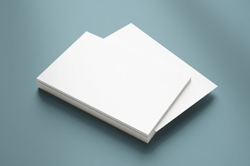 Blank business cards stack on textured grey background as template for design, logo, embossing presentation, promotion, branding etc.