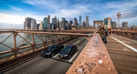 On Brooklyn bridge showing New York Skyline at broad daylight