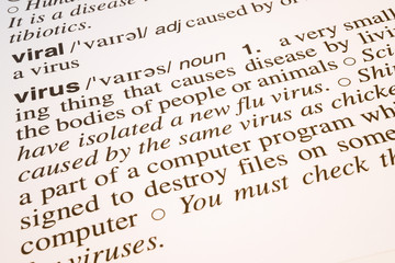 Fototapeta premium Viral and virus words meaning and definition text in English dictionary, Close up text of viral and virus words