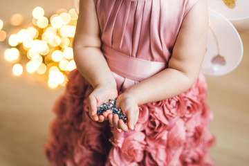  little fairy girl holds in her hands magical sparkles stars