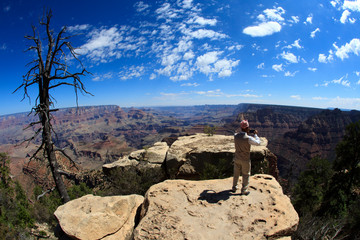 Arizona / USA - August 01, 2015: A tourist looks landscape in South Rim Grand Canyon, Arizona, USA