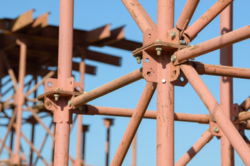 Scaffolding Elements Construction. Metal scaffolding tubes and bars. Construction site details. Bridge support. Industrial background.