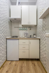 small kitchen interior of flat apartments or hostel