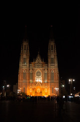 Fototapeta na wymiar The Cathedral of Immaculate Conception (Inmaculada Concepción) lit up at summer night. This neogothic cathedral is located in La Plata, Buenos Aires province, Argentina