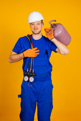 Air conditioning technician. air conditioning repair and pressure gauges, equipment for filling air...