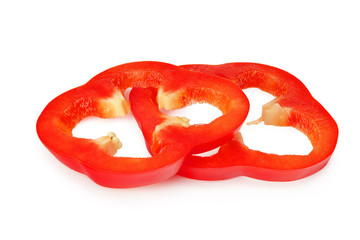 cut slices of red sweet bell pepper isolated on white background