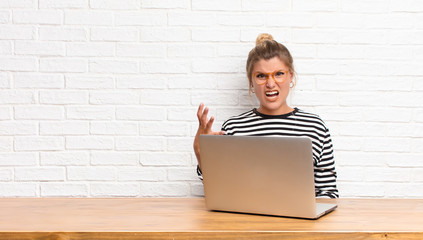 young pretty latin woman looking angry, annoyed and frustrated screaming wtf or what‚Äôs wrong...