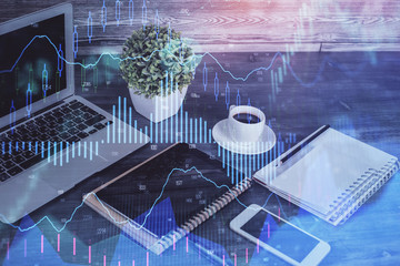 Double exposure of financial graph drawing and cell phone background. Concept of forex trading