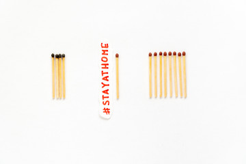 Stay at home as stayathome. Concept how to stop the coronavirus from spreading. Matchsticks burn, one piece prevents the fire from spreading