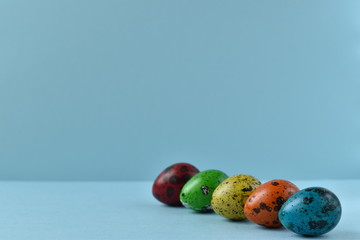Fototapeta na wymiar The quail eggs. Easter painted eggs. Holy Easter.