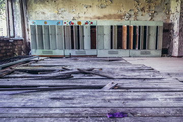 Obraz premium Row of old lockers in abandoned kindergarten in Skrunda 1 Soviet military ghost town and former radar station, Latvia