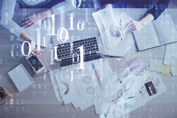 Double exposure of woman hands working on computer and data theme hologram drawing. Top View. Technology concept.