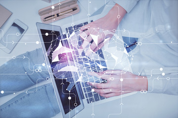 Double exposure of woman working on computer andhuman brain hologram drawing. Top View. Ai concept.