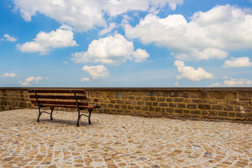 Fototapeta na wymiar Balcone delle Marche or Balcony of Marche with a bench against the sky in Cingoli, Marche Region, Province of Macerata, Italy