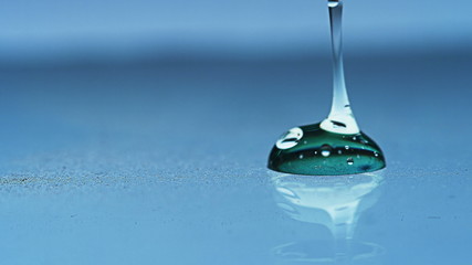 Gel Pouring liquid fluid aqua dip Macro shoot. Clean soft elegant bright photo background. Close-up...