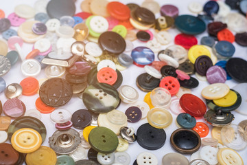 The background with many different colorful buttons on the table