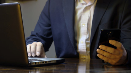 cell and laptop home working office networking marketing business man 