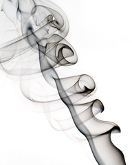 Black smoke on a white background. Abstract artistic design.