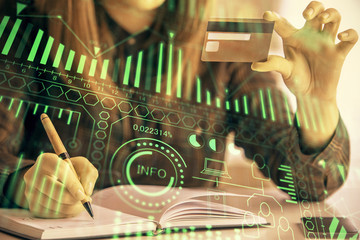 Multi exposure of woman on-line shopping holding a credit card and tech theme drawing. Technology concept.