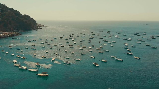 Spain Costa Brava Mediterranean coastline panning from the sea shore, Canyelles Grosses, Roses, Catalonia
