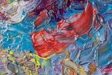 Multi-colored oil paints mixed on a palette. Abstract background