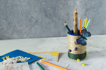 Decorated tin can with jute ropes and decorated with decorative elements. Example of use. DIY,...