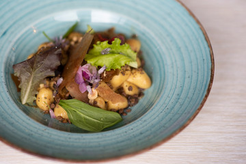mixed salad with bread crusts, potatoes and flowers