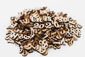 Stack of macro wooden letterpress letters with the text economic crisis in 2020.