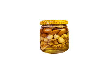 Honey with nuts in a jar, isolate on a white background