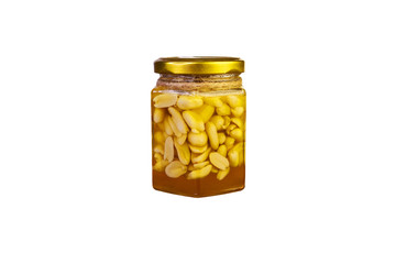 Honey with nuts in a jar, isolate on a white background