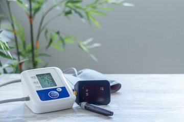 Digital blood pressure monitor for blood pressure monitoring and glucometer to control blood glucose levels