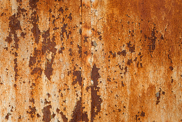 rusted iron wall with old cracked and peeling off white enamel paint