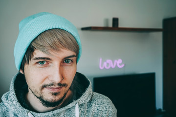 Portrait of a youthful handsome man att home