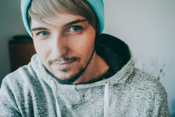 Portrait of a youthful handsome man att home