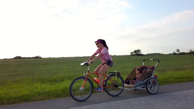 Mother and daughter cycling together, Netherlands