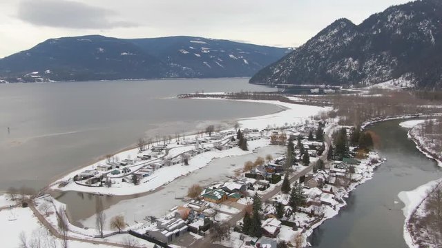 Aerial View of a small Town, Sicamous, in the Interior of British Columbia, Canada. Taken during winter time.